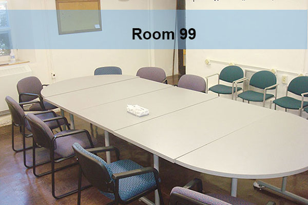 A conference room with tables and chairs